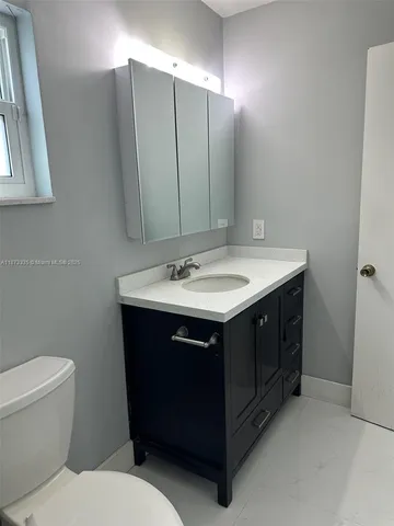 a bathroom with a sink and a toilet