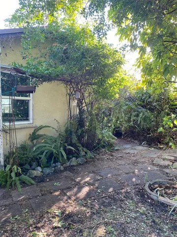 a view of lake with houses in back