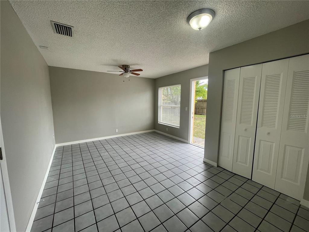 7986 Avenal Loop New Port Richey, FL 34655 - Photo 18 of 23 a view of an empty room and window
