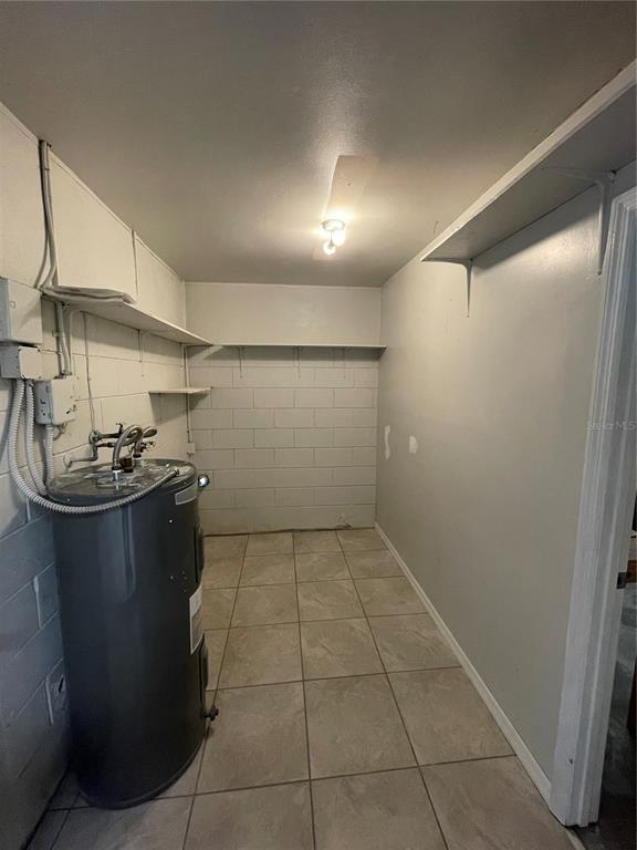 7986 Avenal Loop New Port Richey, FL 34655 - Photo 21 of 23 a view of a storage & utility room with two washing machine