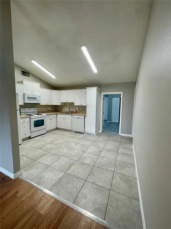 7986 Avenal Loop New Port Richey, FL 34655 - Photo 6 of 23 a view of kitchen with furniture and window