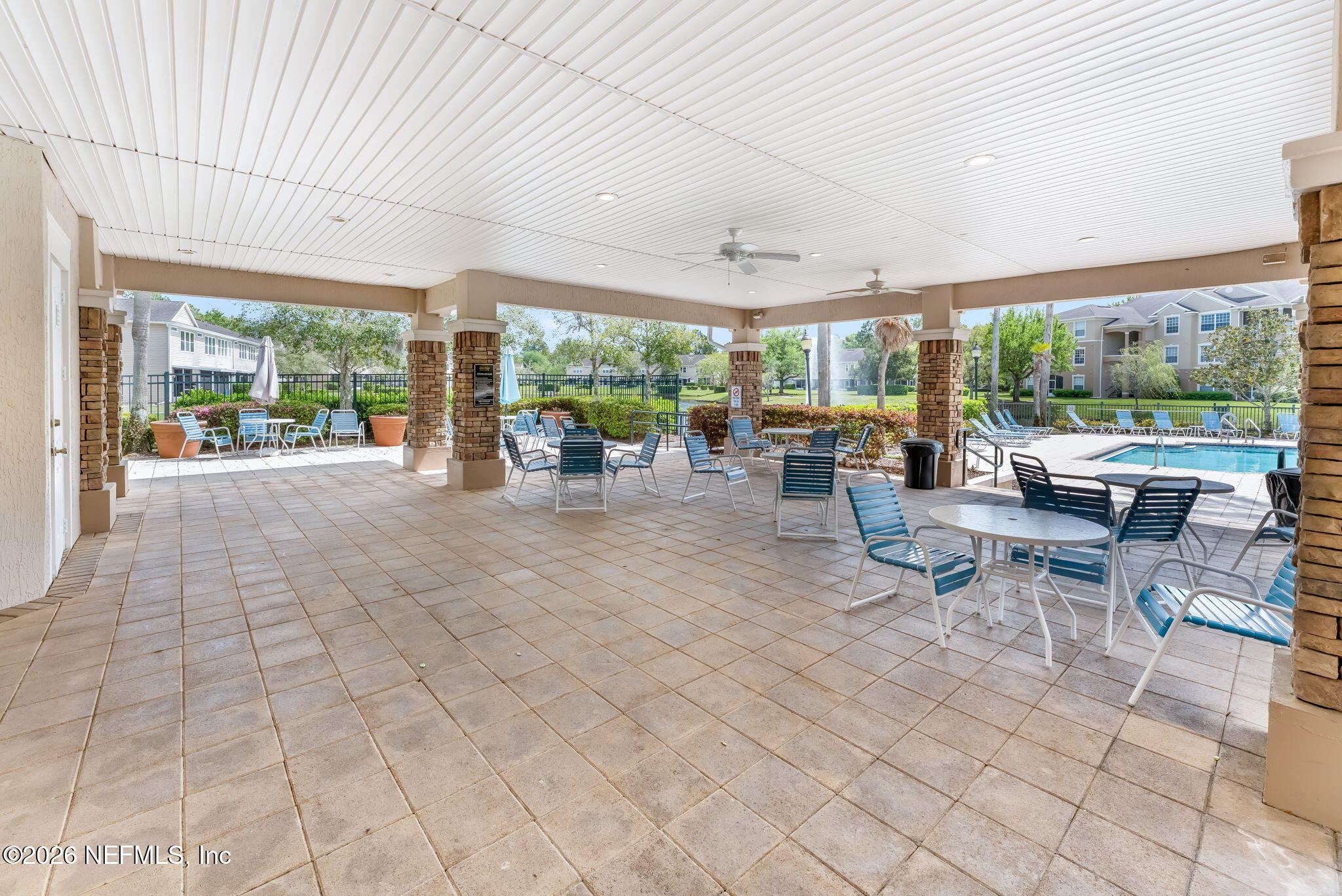 7990 Baymeadows Road East, Unit 520 Jacksonville, FL 32256 - Photo 33 of 41 a view of a patio with dining table and chairs