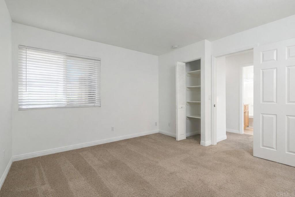 1145 Helix Street, Unit 13 Spring Valley, CA 91977 - Photo 10 of 12 a view of an empty room with a window