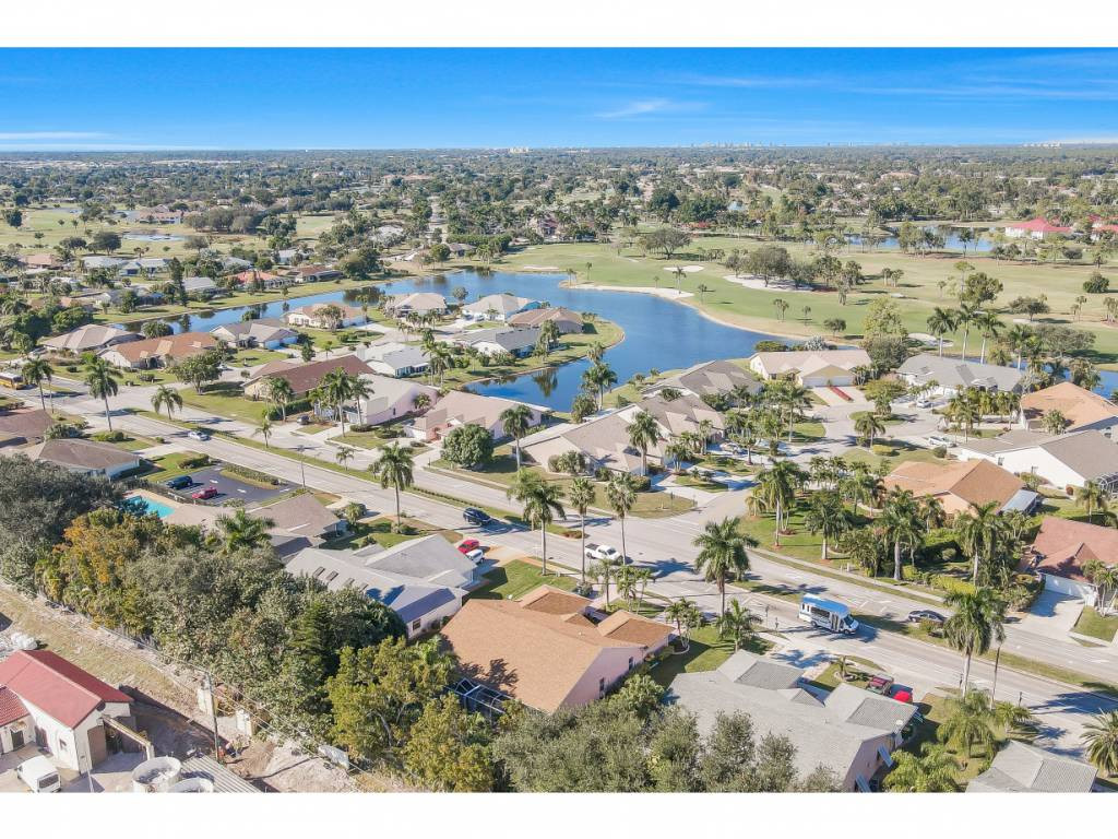 470 St Andrews Boulevard Naples, FL 34113 - Photo 30 of 32 an aerial view of residential houses with outdoor space