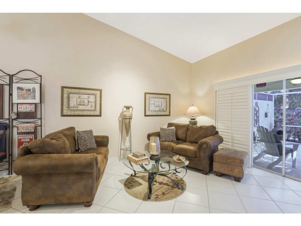 470 St Andrews Boulevard Naples, FL 34113 - Photo 8 of 32 a living room with furniture and a couch