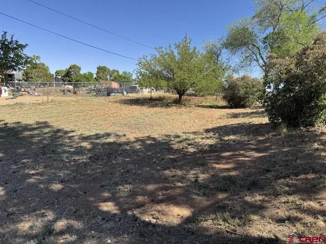 a view of a backyard of the house
