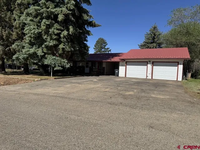 a house with trees in front of it