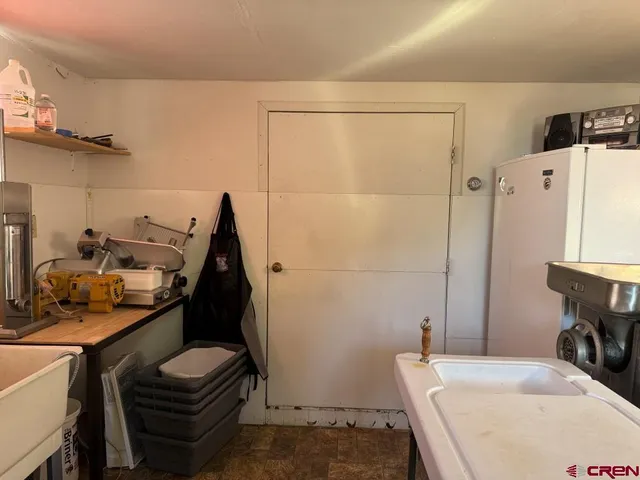 a room with furniture a flat screen tv and a fireplace