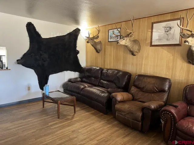 a kitchen with kitchen island a counter top space a sink stainless steel appliances and cabinets