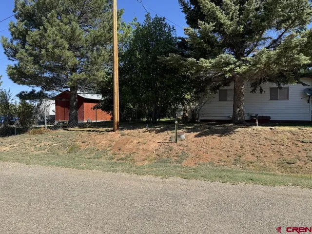a view of a backyard of the house