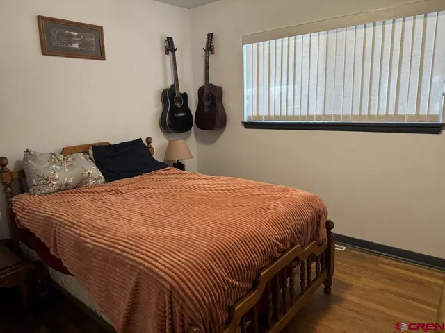 a bedroom with a bed and a cabinets