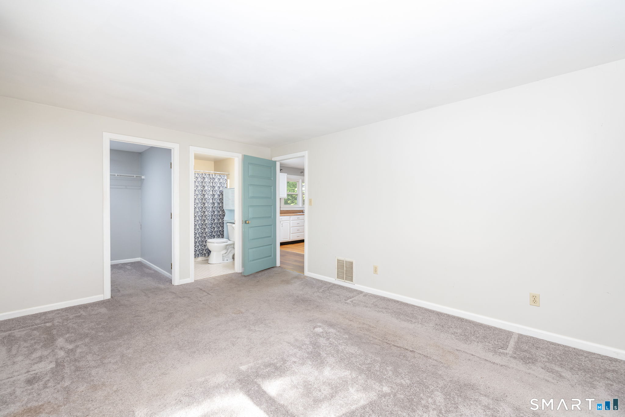 347 Griffin Road Suffield, CT 06093 - Photo 13 of 35 an empty room with closet and natural light