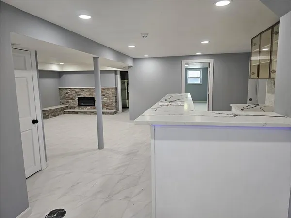 a bathroom with a shower and a sink