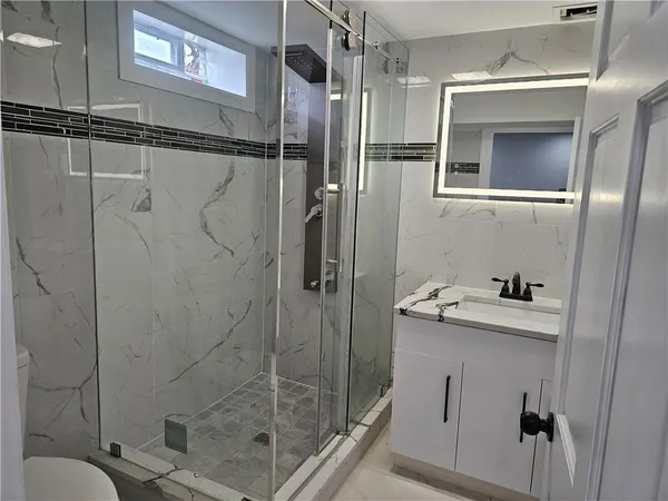 a bathroom with a sink and mirror