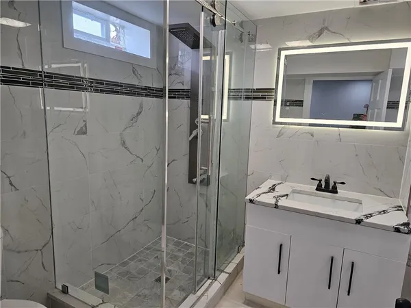 a bathroom with a shower and a toilet