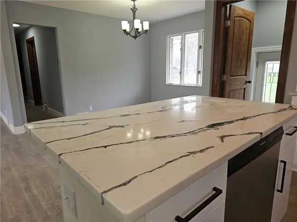 view of a kitchen with a sink and dishwasher