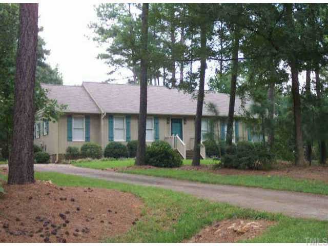 9820 Gralyn Road Raleigh, NC 27613 - Photo 1 of 1 a front view of a house with a yard and garage