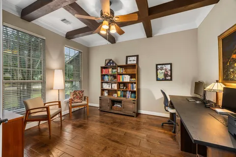 a view of a livingroom with furniture and a bookshelf