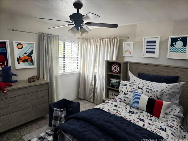 a bedroom with a bed dresser and a window