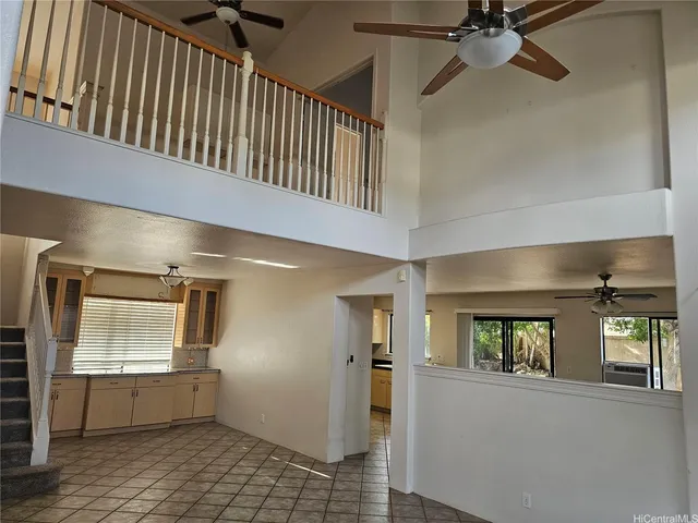 a view of hallway with window and stairs