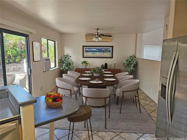 a dining room with furniture and wooden floor