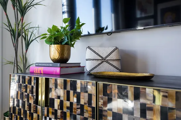 a living room with blue walls and a wooden floor
