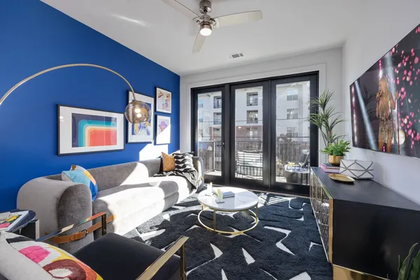 a living room with furniture fireplace and a flat screen tv