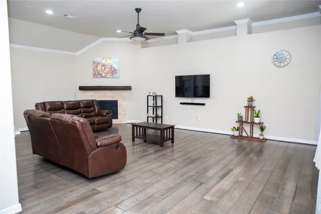 a kitchen with stainless steel appliances kitchen island granite countertop a sink and cabinets
