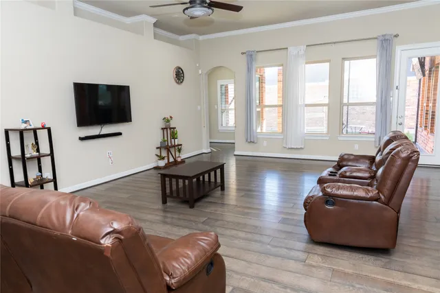 a living room with furniture and a flat screen tv