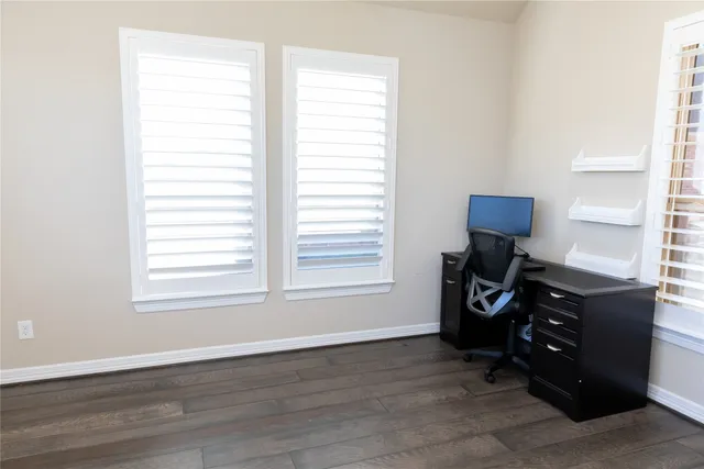 a bedroom with furniture and a book shelf