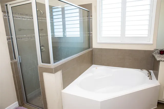 a view of storage and utility room with washer and dryer