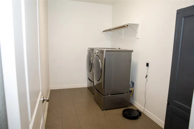a view of a patio with a table and chairs and wooden floor