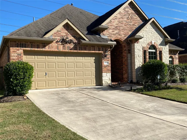 an empty room with wooden floor and mirror