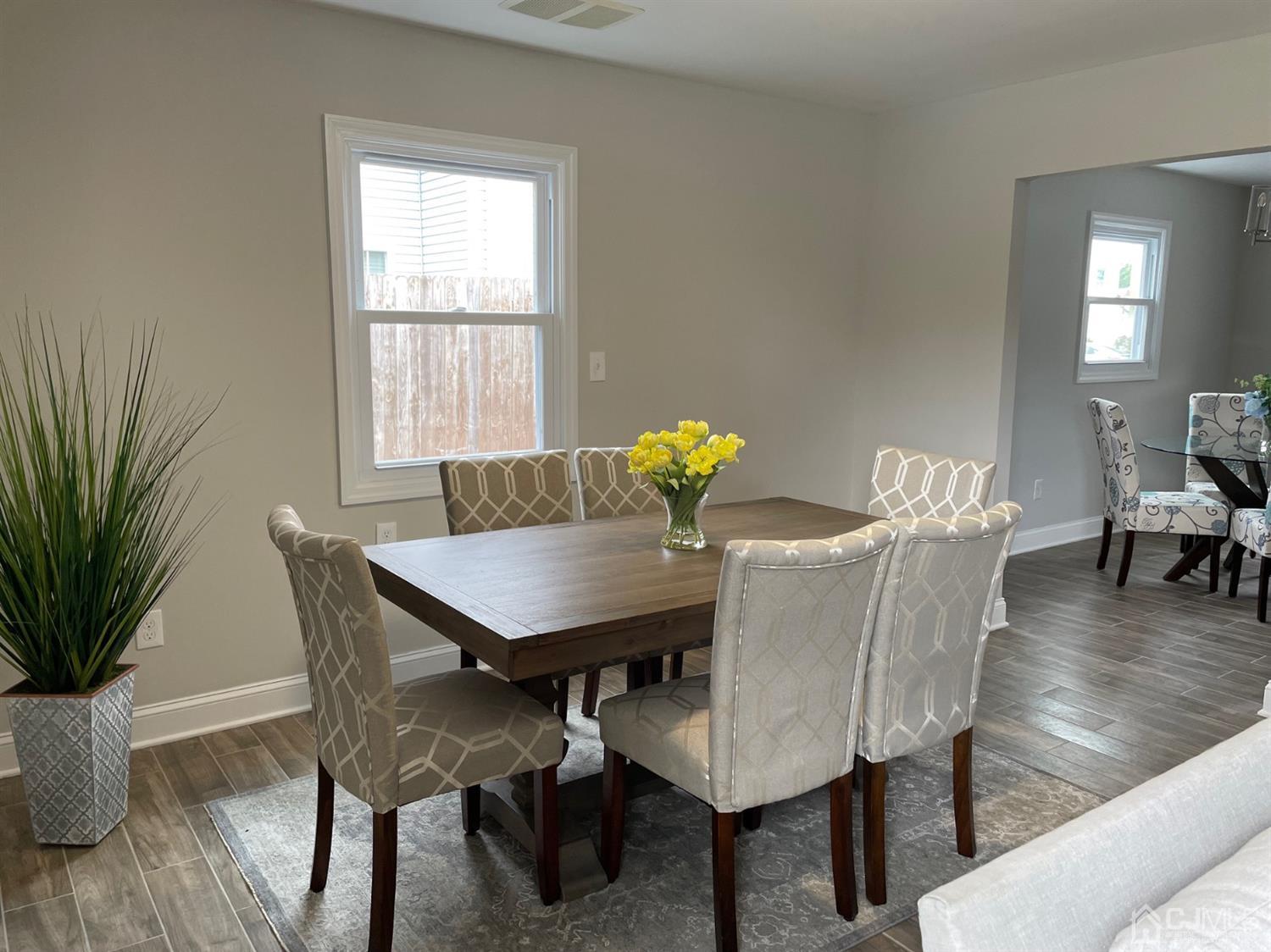 28 Rosewood Road Edison, NJ 08817 - Photo 8 of 14 a view of a dining room with furniture and wooden floor