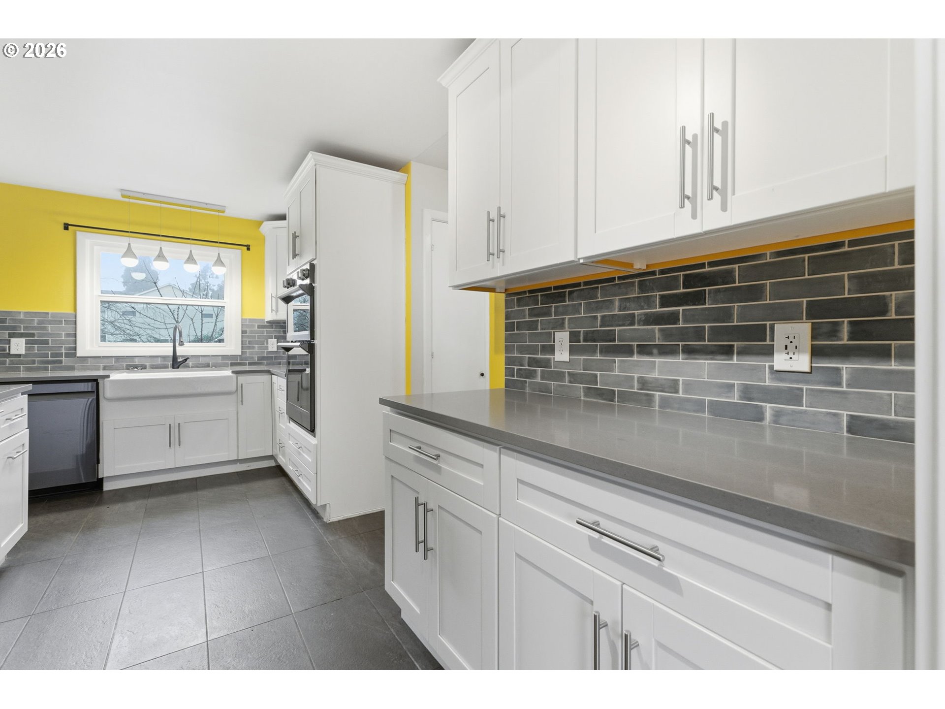 19 Northeast 139th Avenue Portland, OR 97230 - Photo 16 of 48 a kitchen with white cabinets and white appliances