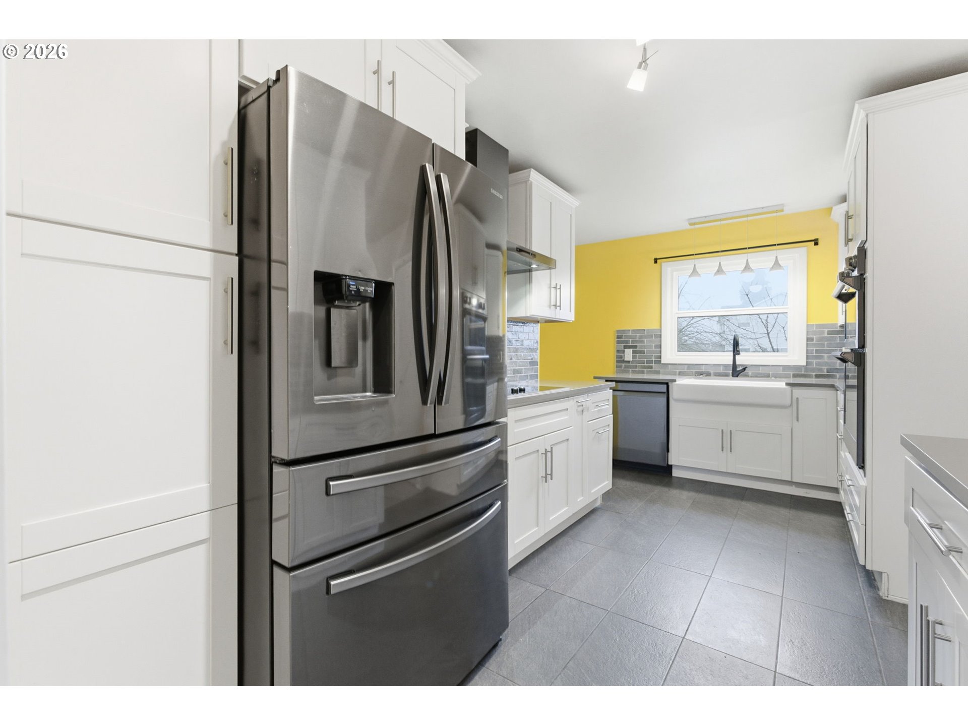 19 Northeast 139th Avenue Portland, OR 97230 - Photo 17 of 48 a kitchen with stainless steel appliances a refrigerator sink and cabinets