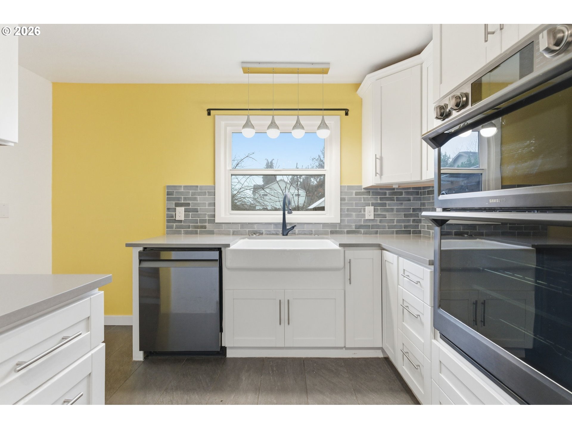 19 Northeast 139th Avenue Portland, OR 97230 - Photo 18 of 48 a kitchen with a sink and large window