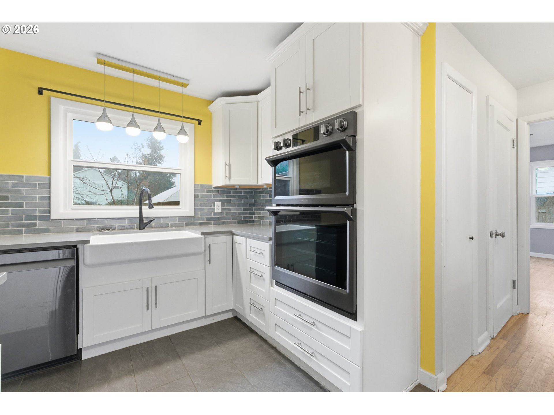 19 Northeast 139th Avenue Portland, OR 97230 - Photo 19 of 48 a kitchen with stainless steel appliances a stove sink and microwave