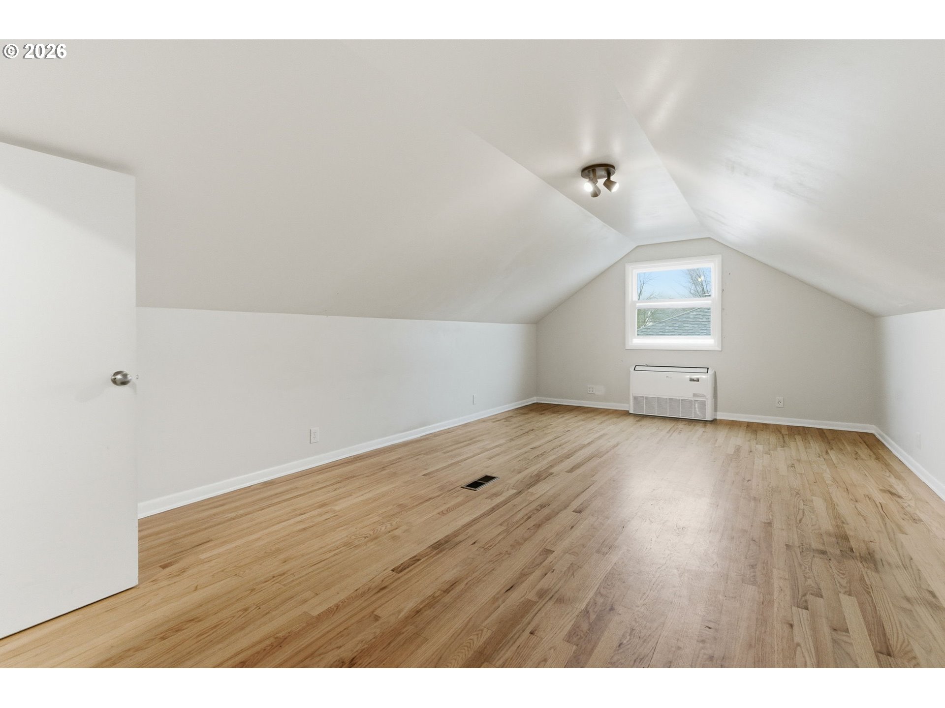 19 Northeast 139th Avenue Portland, OR 97230 - Photo 31 of 48 a view of an empty room with wooden floor and a window