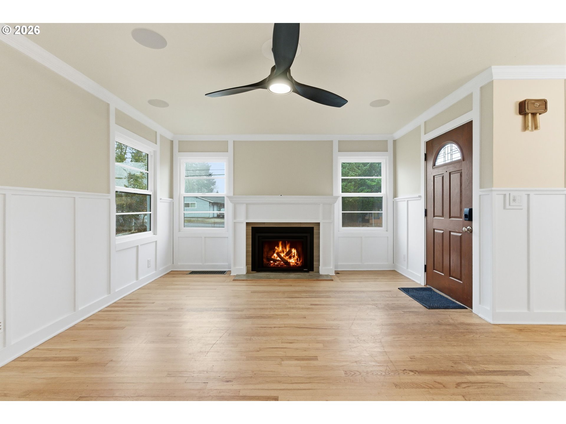 19 Northeast 139th Avenue Portland, OR 97230 - Photo 5 of 48 a view of an empty room with wooden floor fireplace and a window