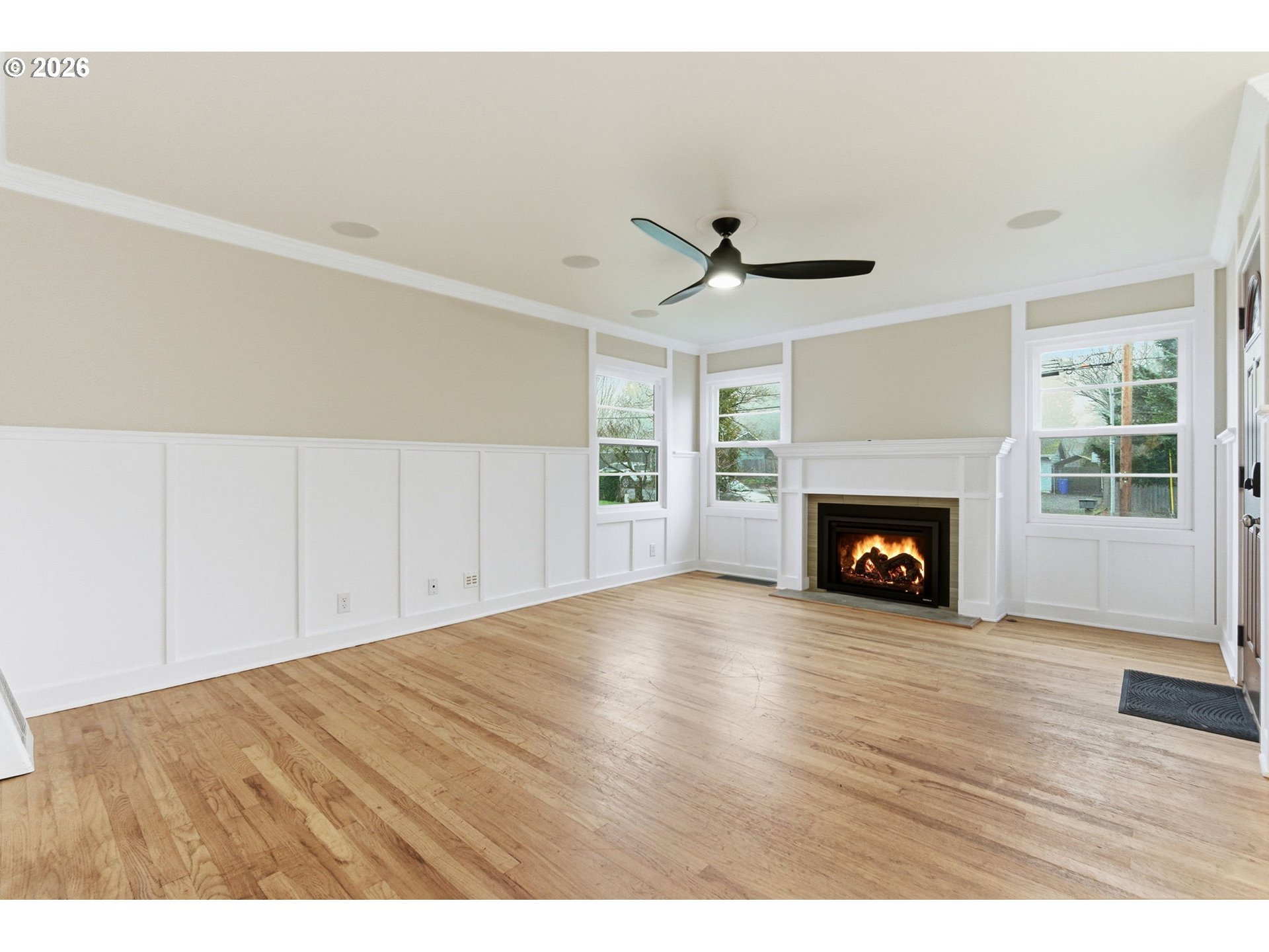 19 Northeast 139th Avenue Portland, OR 97230 - Photo 6 of 48 a view of empty room with wooden floor and fireplace