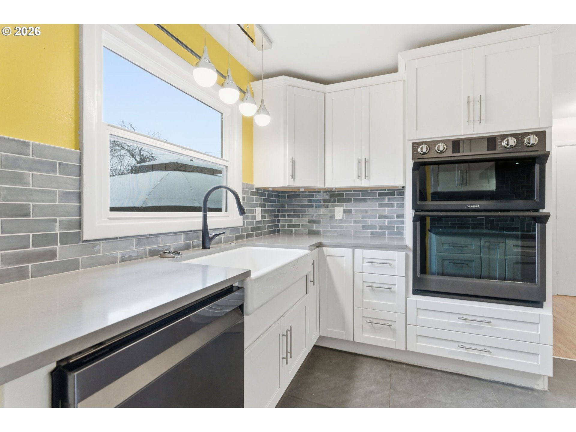 19 Northeast 139th Avenue Portland, OR 97230 - Photo 10 of 48 a kitchen with a sink cabinets and stainless steel appliances