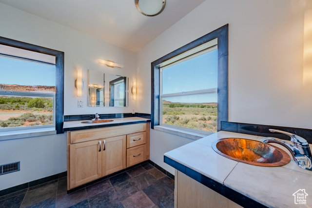 6178 East Zion Road Kanab, UT 84741 - Photo 26 of 48 Bathroom with vanity and stone finish floors