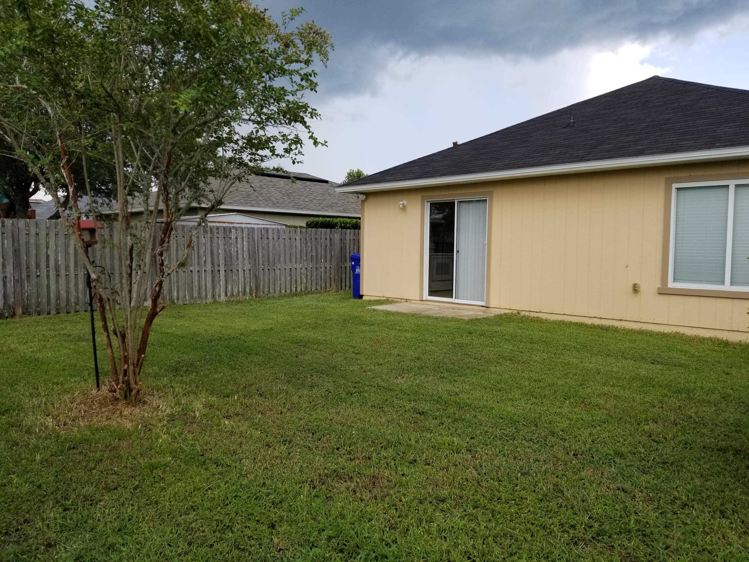 137 Buck Run Way St. Augustine, FL 32092 - Photo 14 of 21 a backyard of a house with lots of green space