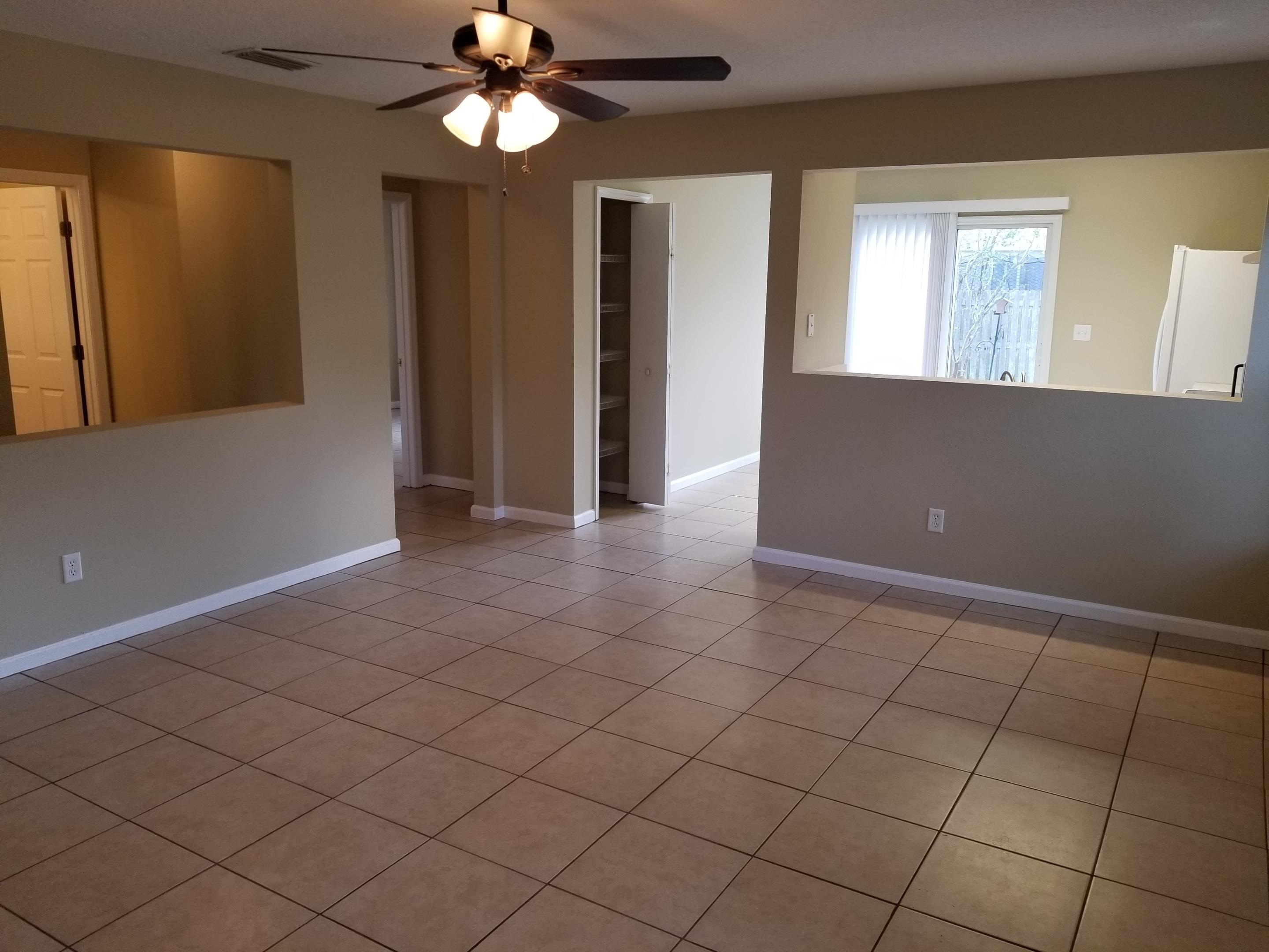 137 Buck Run Way St. Augustine, FL 32092 - Photo 6 of 21 a view of a livingroom with a chandelier fan