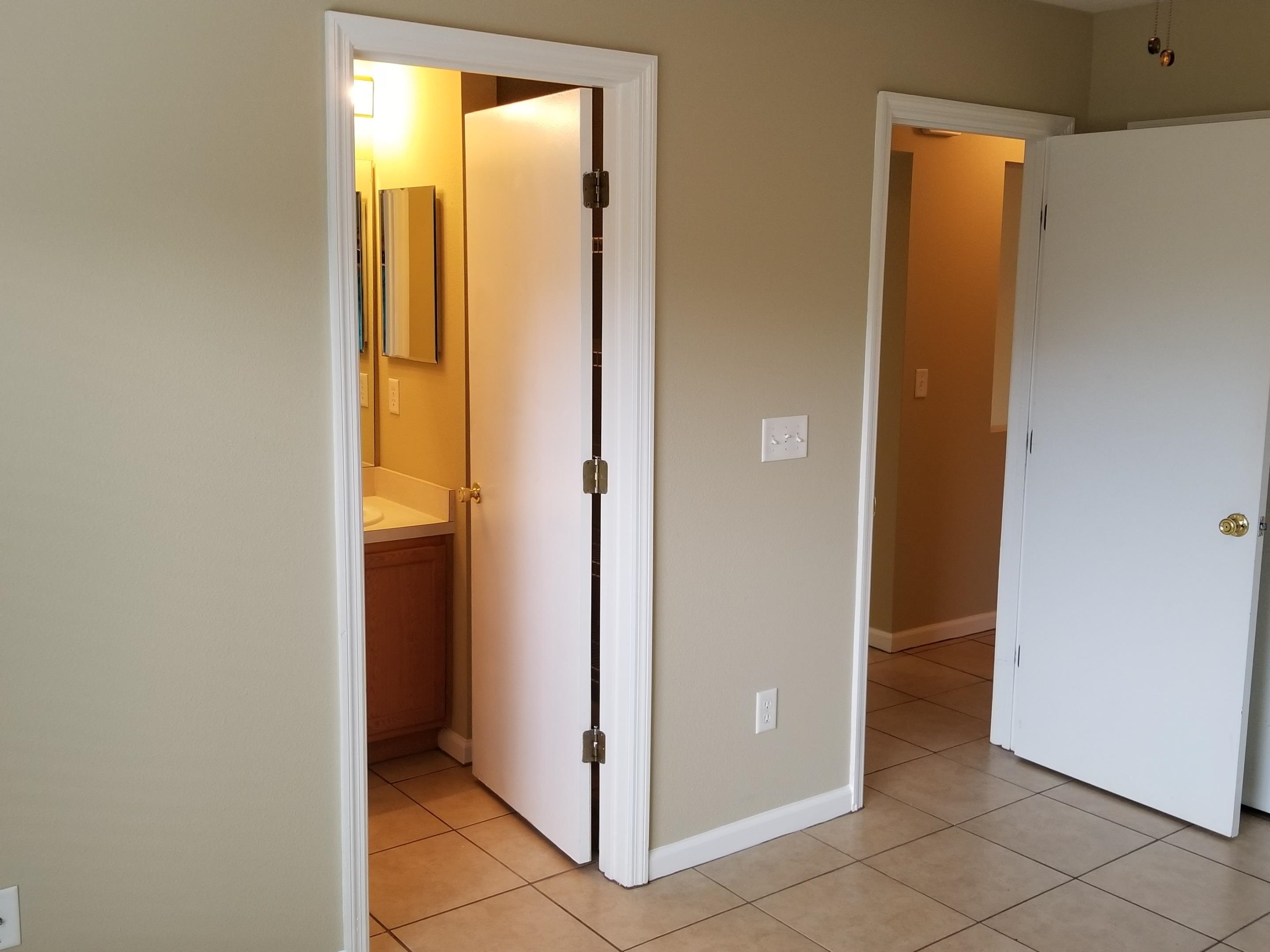 137 Buck Run Way St. Augustine, FL 32092 - Photo 7 of 21 a view of bathroom with a door and a closet