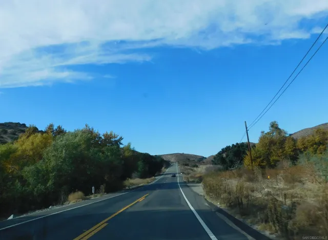 a brick building with a street sign on it