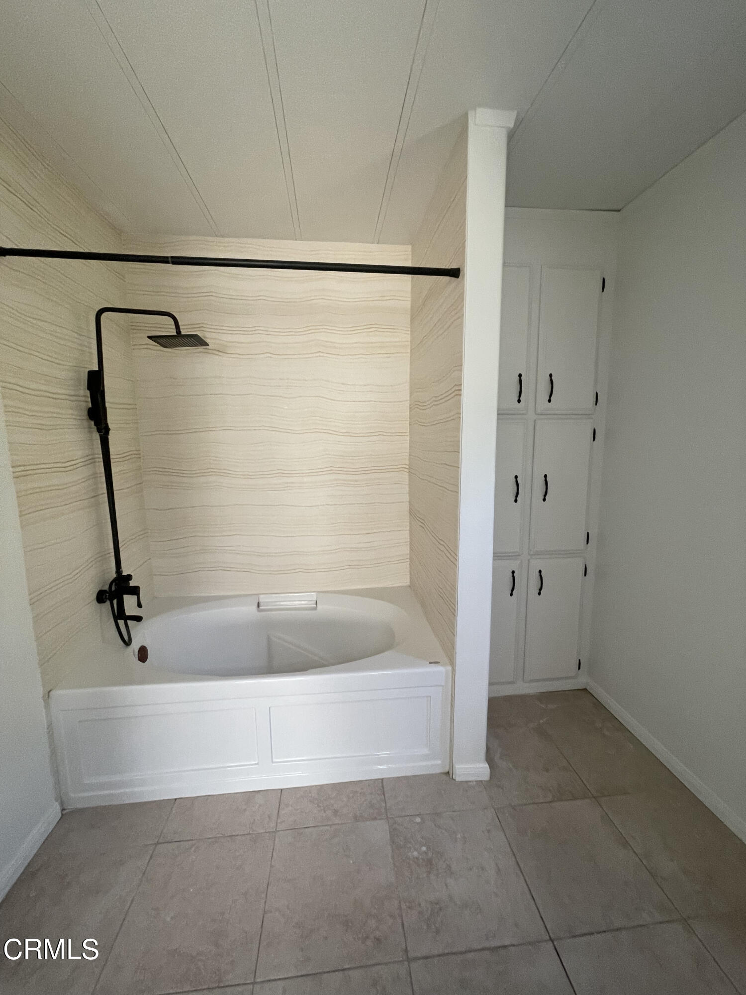 15750 Arroyo Drive, Unit 80 Moorpark, CA 93021 - Photo 12 of 19 a bathroom with a bathtub and a shower
