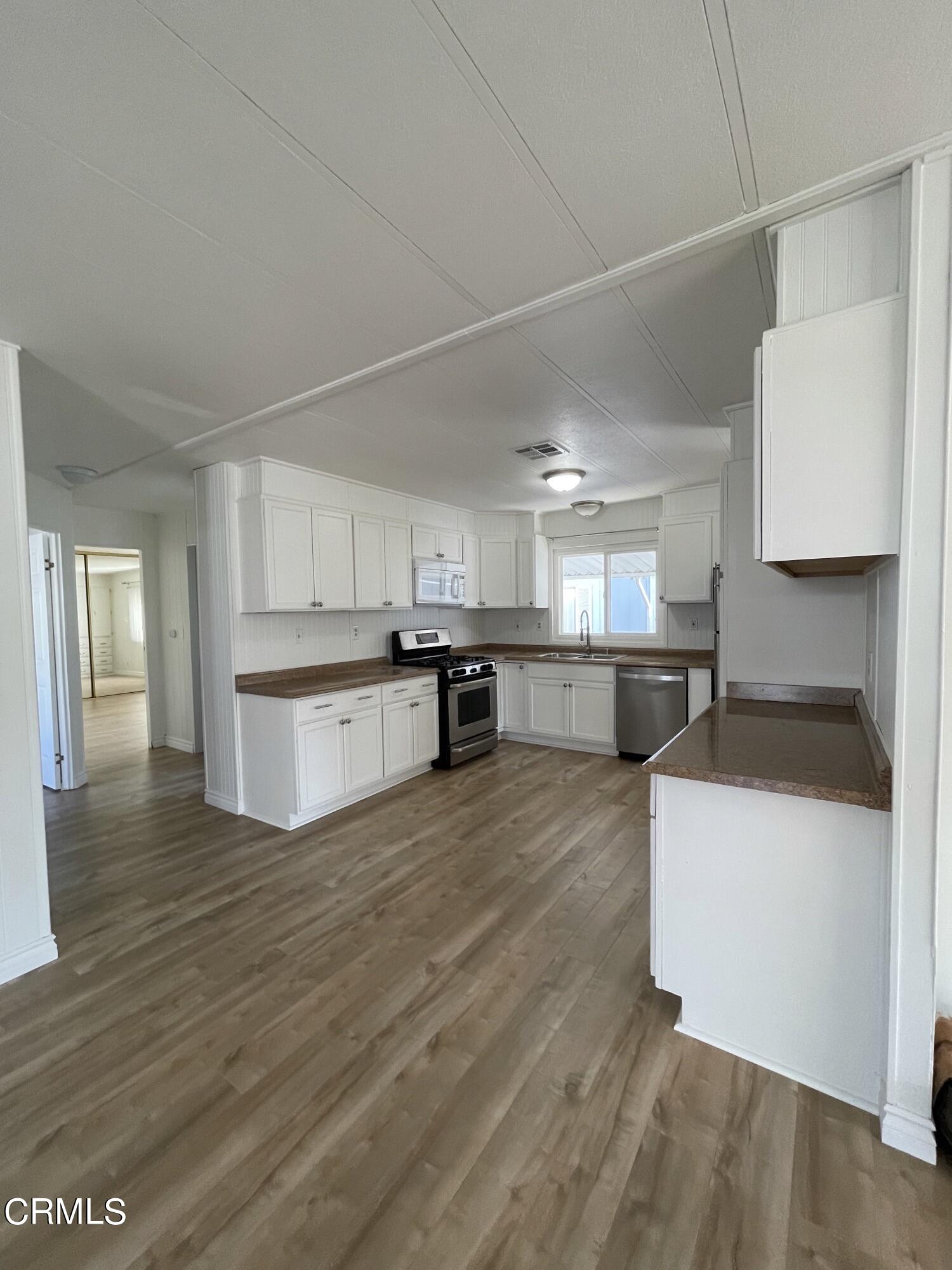 15750 Arroyo Drive, Unit 80 Moorpark, CA 93021 - Photo 14 of 19 a view of kitchen with wooden floor