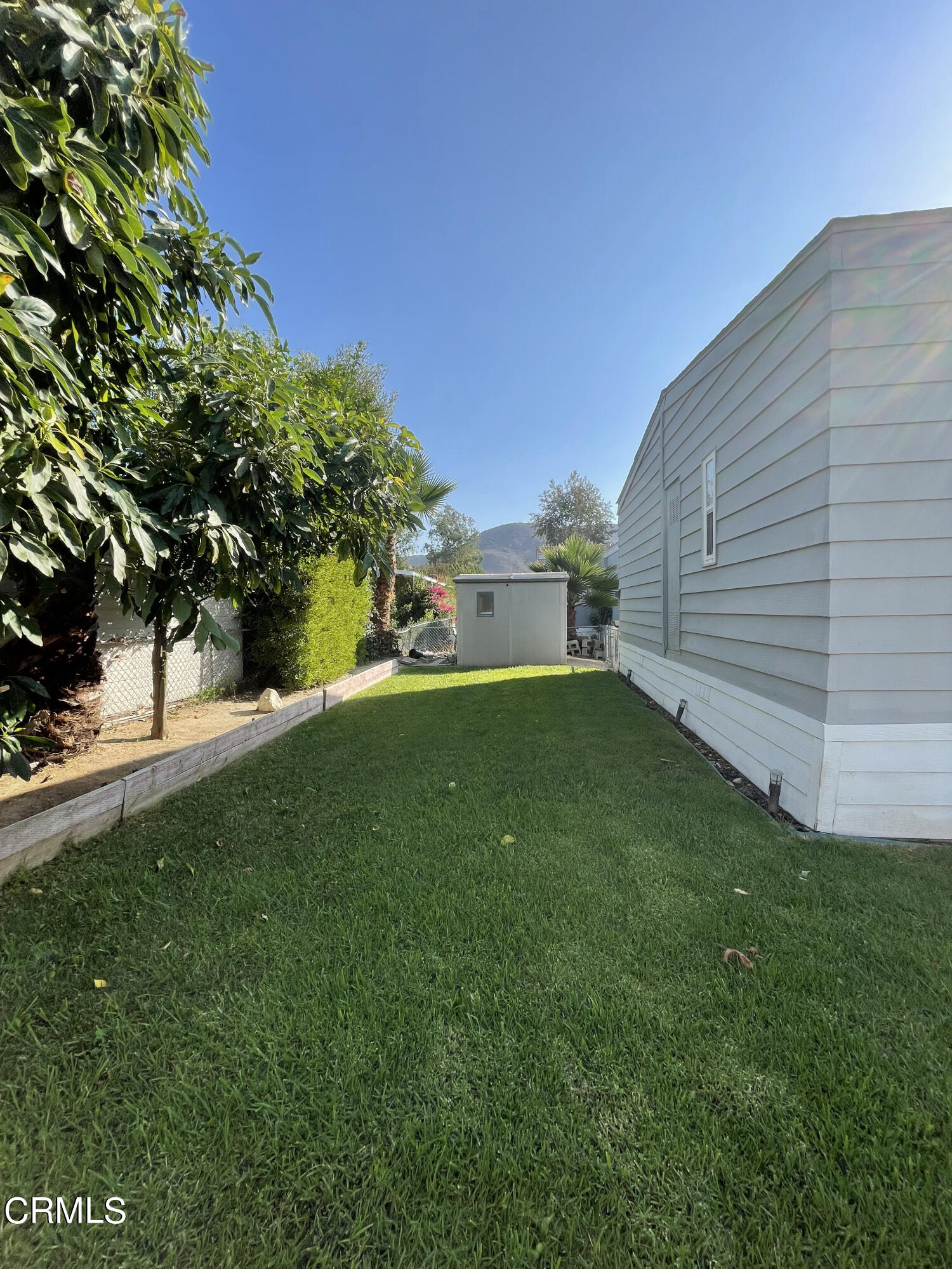 15750 Arroyo Drive, Unit 80 Moorpark, CA 93021 - Photo 4 of 19 a view of a backyard with a garden